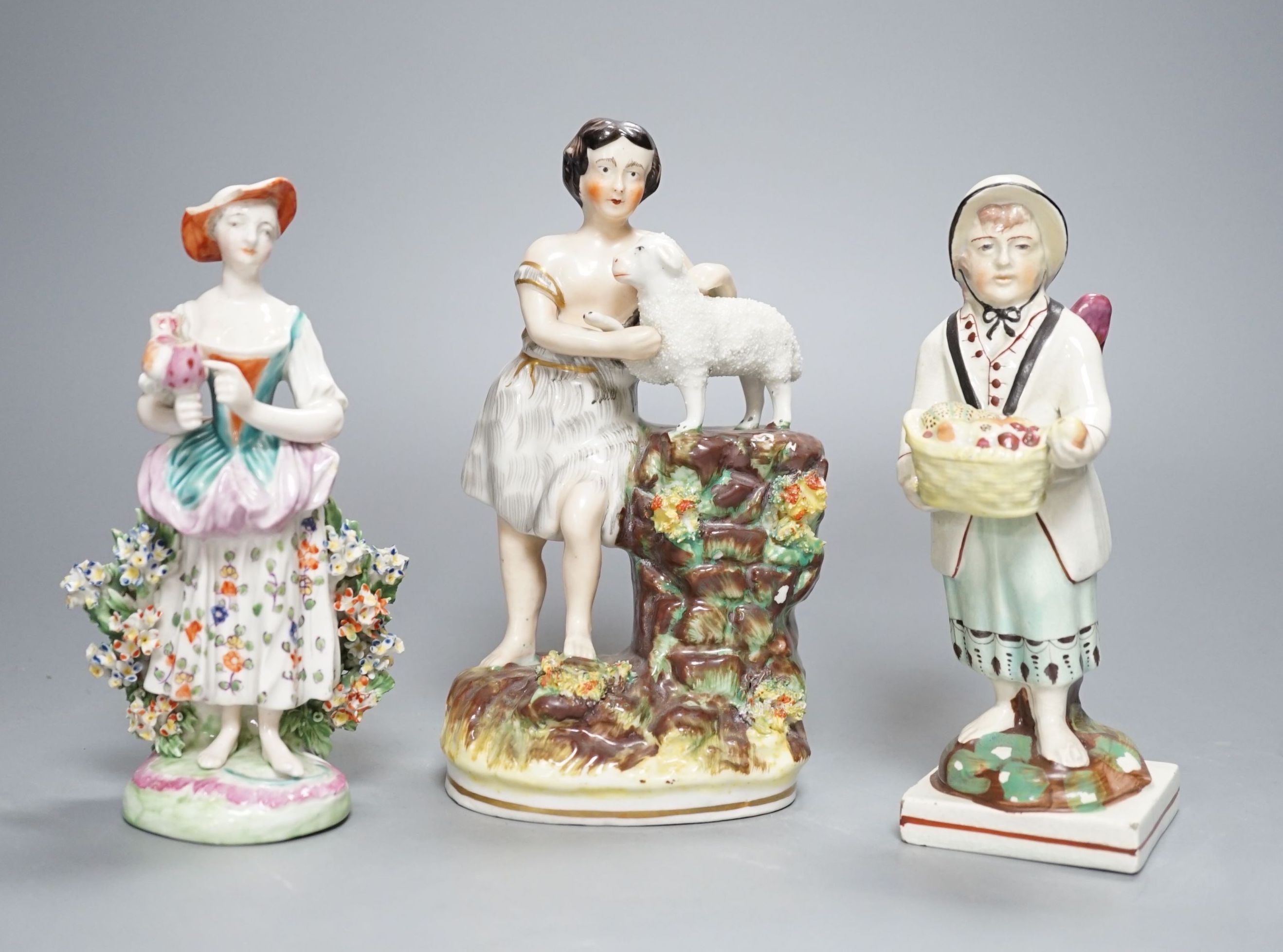 A Chelsea-Derby bocage figure, 16cm, 19th century pearlware figure of Cupid disguised and one other Staffordshire figure